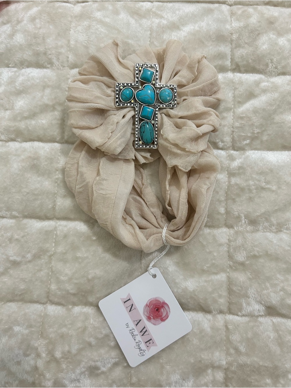 This bow is soft and stretchy with turquoise cross accent